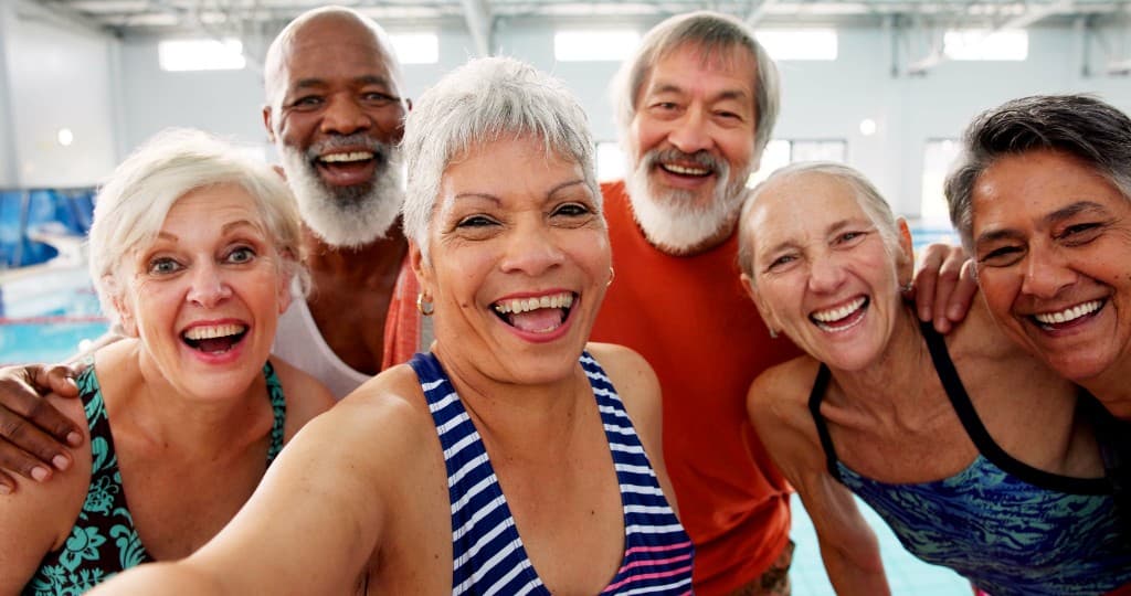 Happy seniors at the swimming pool